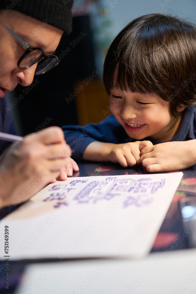 Asian father and son happy drawing at home Asian father and son happy drawing at home
