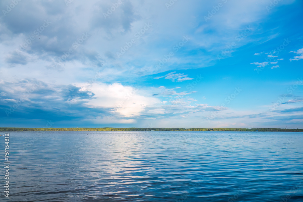 Blue lake with cloudy sky, natural background