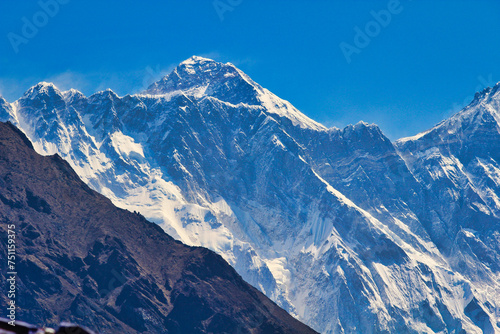 Everest Summit pyramid can be seen over the long Nuptse ridge line in this long range shot taken from Namche Bazaar Nepal