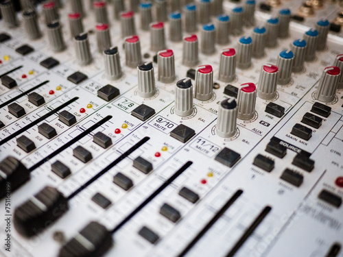 Old sound mixer desk with dials photo