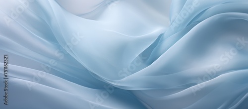 A detailed view of delicate white silk organza fabric, showcasing its intricate open weave texture against a blue background pattern.
