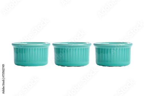 Three Green Cups in a Row. The image shows three green cups placed side by side on a surface. Each cup is identical in color and design  creating a neat and uniform arrangement.
