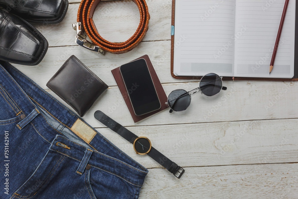 Top View Accessoires Travel With Man Clothing Concept Shirt Jean Mobile Phone Wooden Background Watch Sunglasses Shoes Wood Table Top View Accessoires Travel With Man Clothing Concept Shirt Jean Mobile Phone Wooden Background Watch Sunglasses Shoes Wood Table