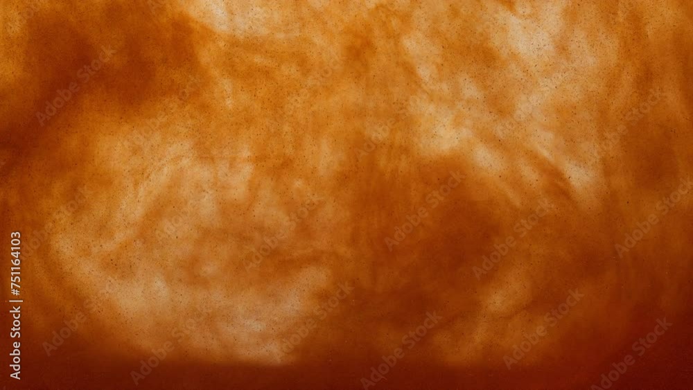orange particles in liquid smoke, epic abstract visual in golden bright slowmotion