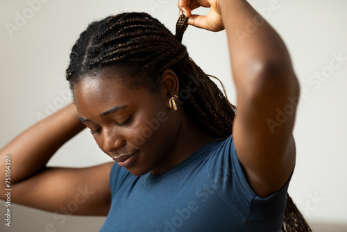 Woman Fixing Her Hair  photo