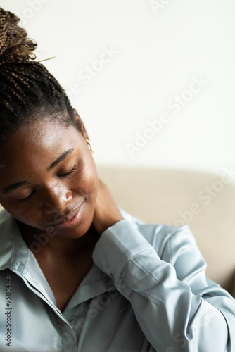 Woman Massaging Her Neck photo