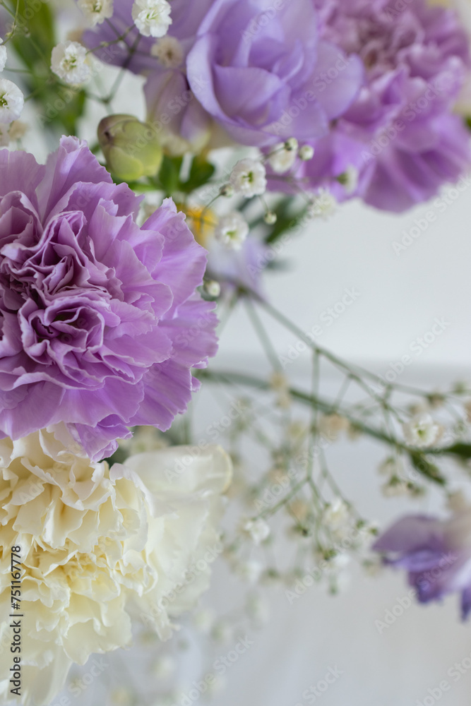 Bouquet of pale purple and white carnations close up. Beautiful blooming lilac flowers. Floral photo with copy space Bouquet of pale purple and white carnations close up. Beautiful blooming lilac flowers. Floral photo with copy space