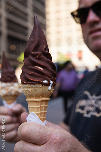 Middle age man holding ice cream cone