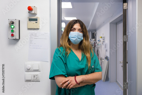 Nurse standing near door in hospital photo