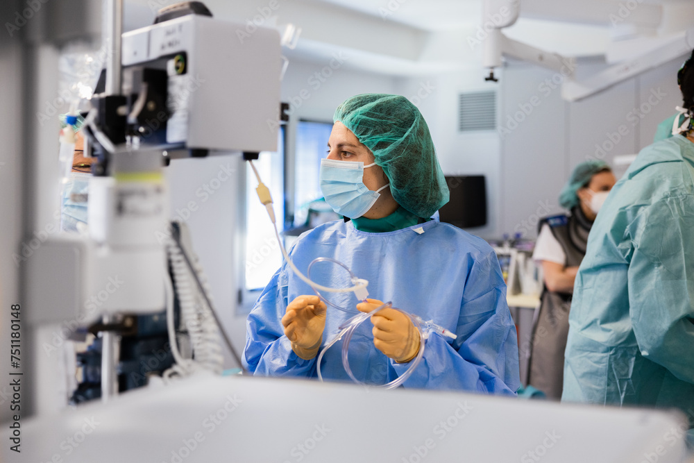 Woman doctor in uniform and cap standing near equipment Woman doctor in uniform and cap standing near equipment