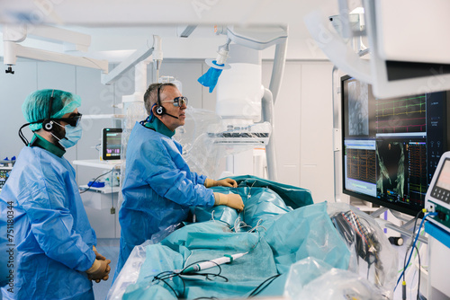 Surgeons during heart operation with electrophysiology photo