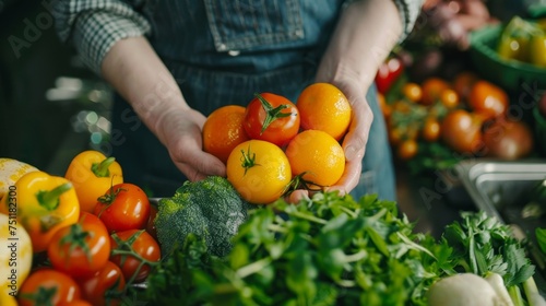 Person holding fresh tomatoes and oranges. Close-up shot with selective focus. Healthy eating and vegetarian food concept for design and print