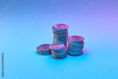 Cent coins against neon background.