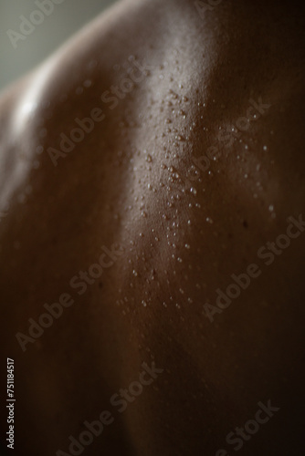 Water drops on male skin photo