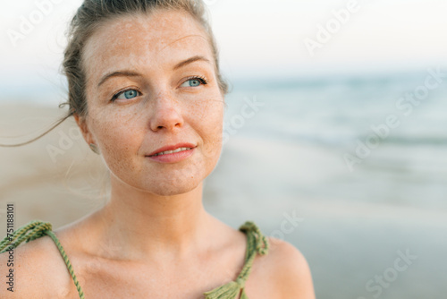Headshot of a woman with dreamy facial expression photo