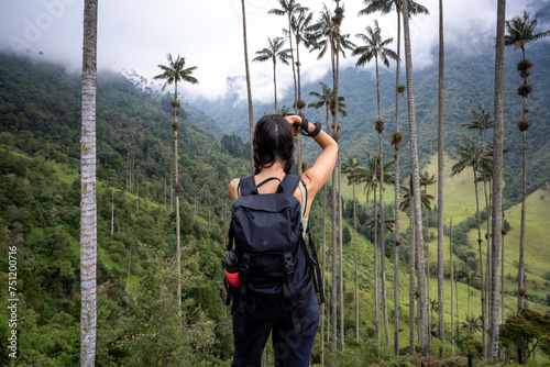 Woman taking pictures in the Cocora Valley