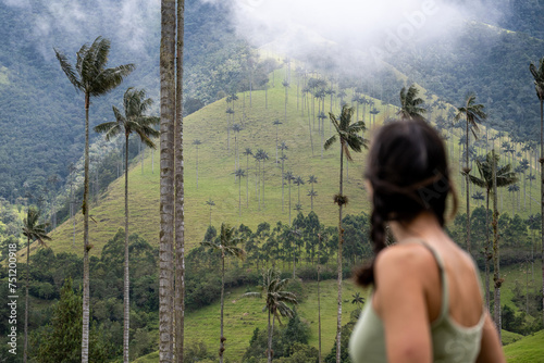 Blurred Tourist Woman Trekking In Mountains photo