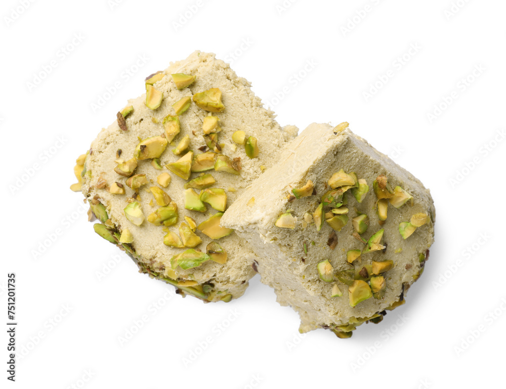 Pieces of tasty halva with pistachios on white background, top view Pieces of tasty halva with pistachios on white background, top view