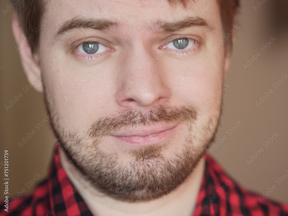 Obraz premium Young man, portrait on the beige background.