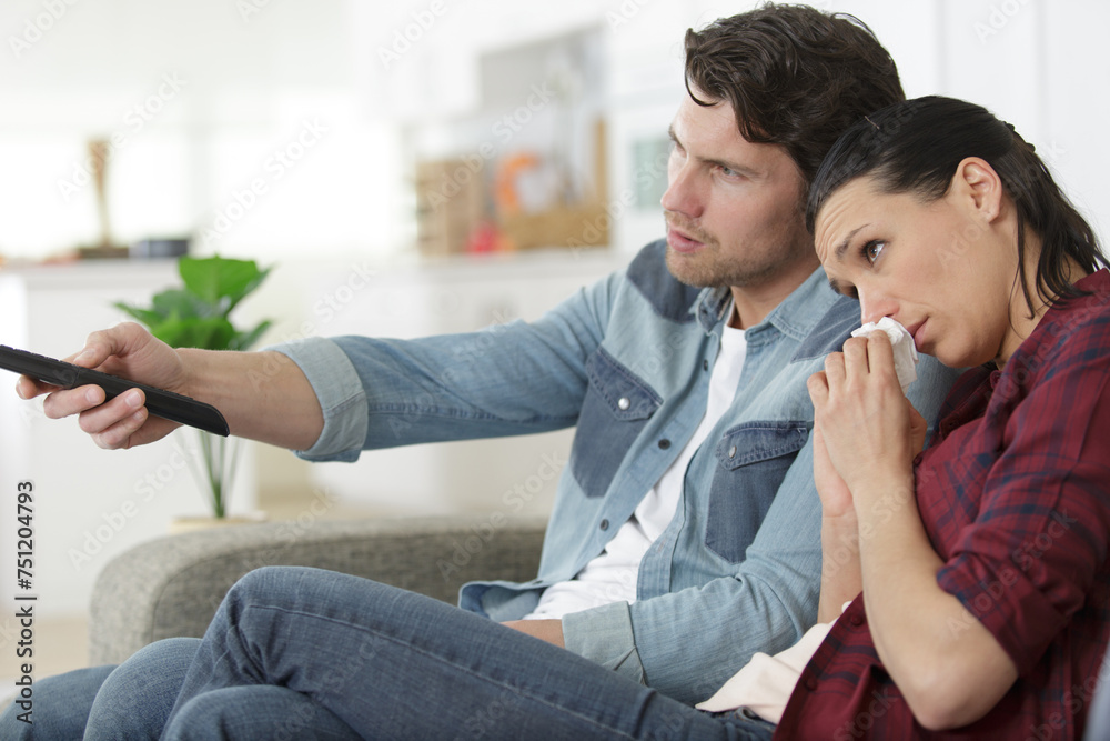sensitive couple watching emotional programme on television sensitive couple watching emotional programme on television