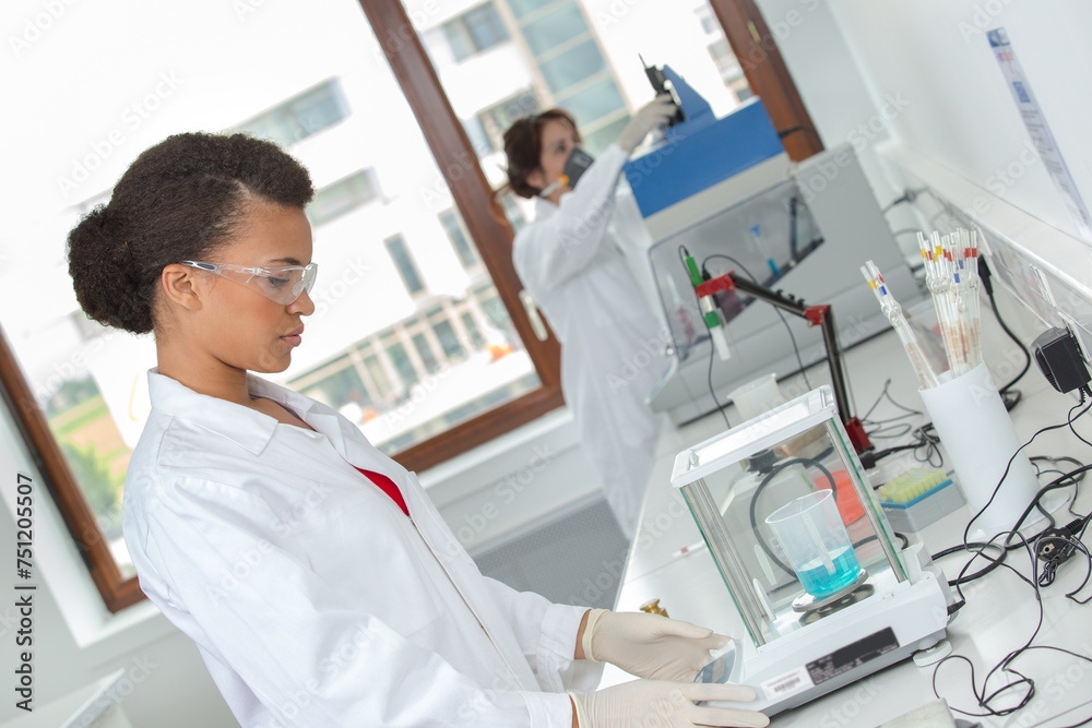 woman reseacher looking in moderrn microscope woman reseacher looking in moderrn microscope