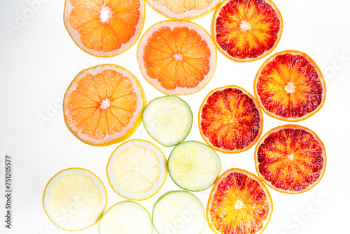 Slices of citrus fruit on white background