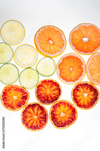 Slices of citrus on a white background