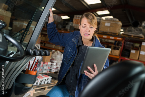 portrait of a woman checking tablet