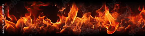 Fiery Flames: Closeup of Intense Fire Flames on Black Background for Wallpaper and Heat-Themed