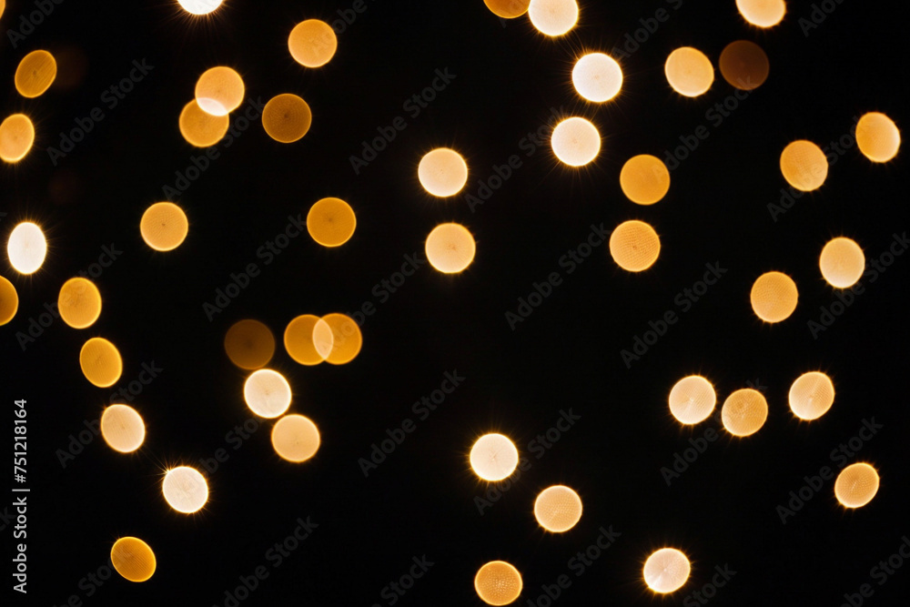 a photo of blurred lights and bokeh against a black background. ai generative
