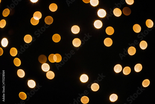a photo of blurred lights and bokeh against a black background. ai generative