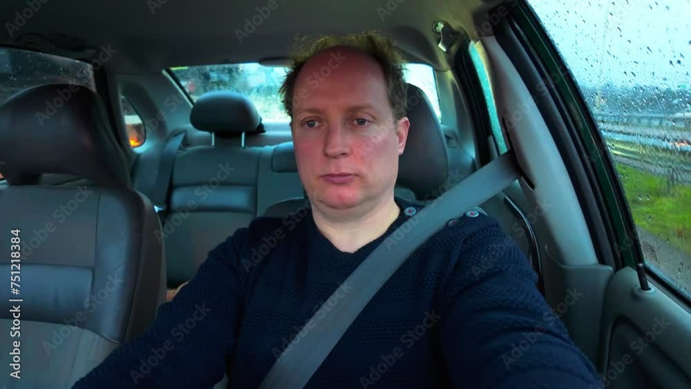 White caucasian adult man driving in car in traffic jam during morning White caucasian adult man driving in car in traffic jam during morning
