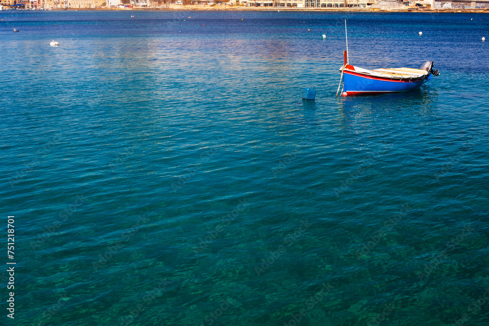 Fototapeta premium Saint Julian Bay with traditional colourful fishing Boats Luzzu, Malta