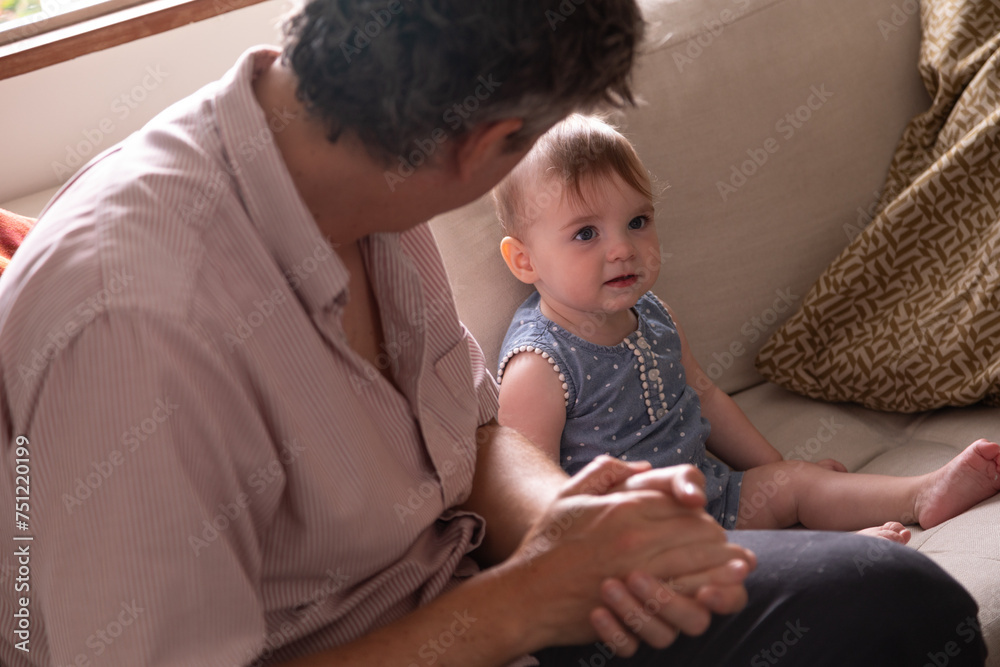 Father spending time with his baby at home Father spending time with his baby at home