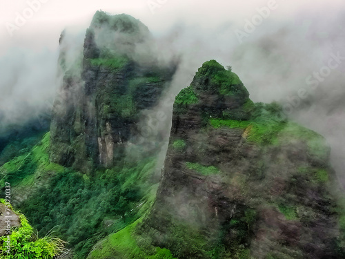 Mist covered mountains at Tamhini ghats photo