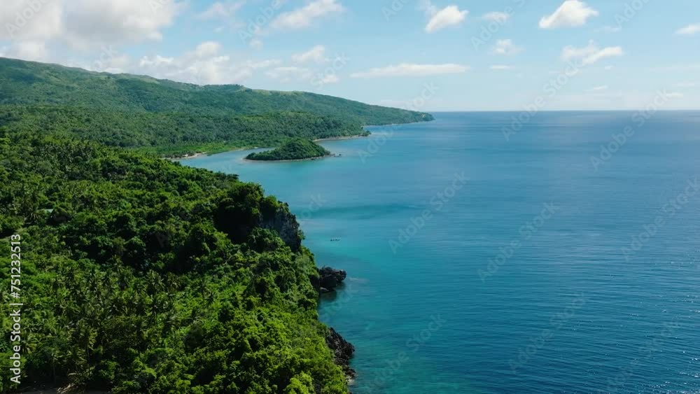 Tropical beach and blue sea with sun reflection. Blue sky and clouds. Romblon, Romblon. Philippines. Tropical beach and blue sea with sun reflection. Blue sky and clouds. Romblon, Romblon. Philippines.