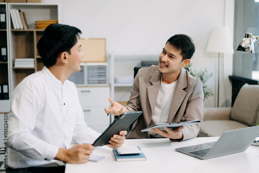Portrait of success business people working together in office. Couple teamwork startup concept.. Portrait of success business people working together in office. Couple teamwork startup concept..