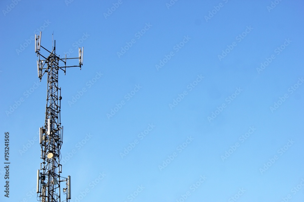 Telephone tower and sunny weather during the day Telephone tower and sunny weather during the day
