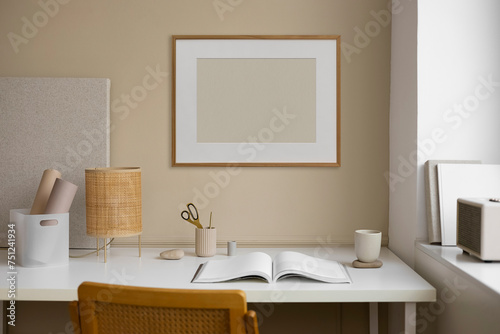 Frame with an blank space against a modern workspace photo