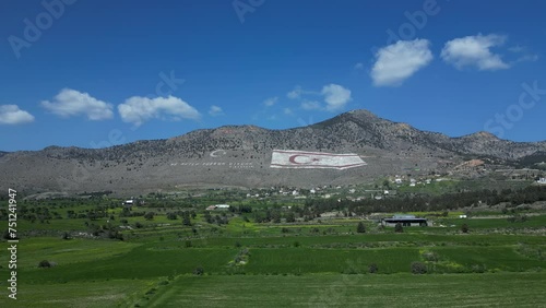 Landscape. Mountains, meadows, plains and the flag of Northern Cyprus. 