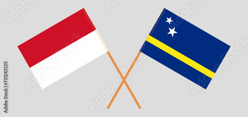 Crossed flags of Indonesia and Country of Curacao. Official colors. Correct proportion