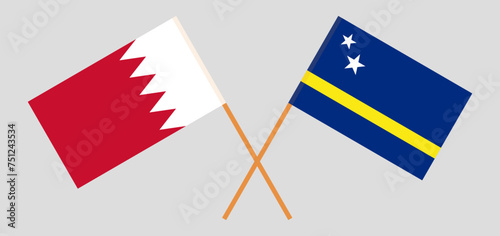 Crossed flags of Bahrain and Country of Curacao. Official colors. Correct proportion