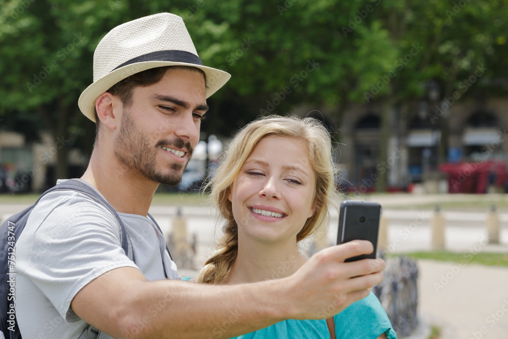 couple in love taking selfies while traveling