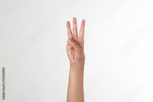 Raised hand showing number 3, isolated white background