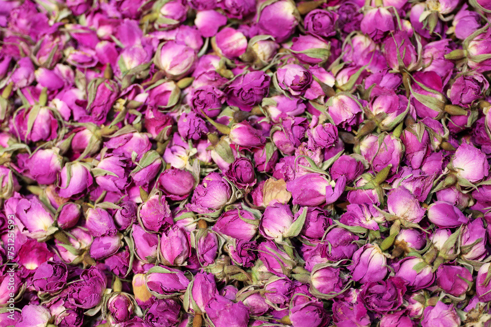 Dry roses for herbal tea, purple flowers for background
