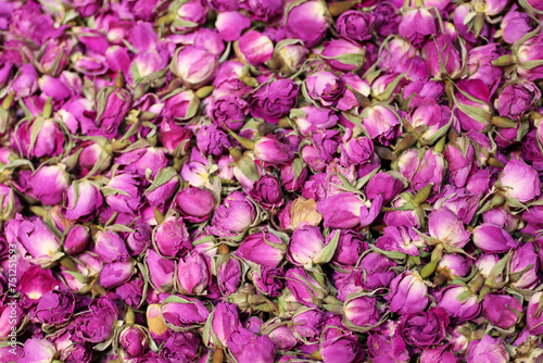 Dry roses for herbal tea, purple flowers for background