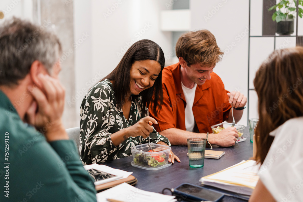Businesspeople Eating Lunch Together In Coworking Space Businesspeople Eating Lunch Together In Coworking Space