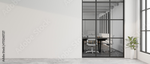 A contemporary white office corridor features a window showing the meeting room and a white wall.