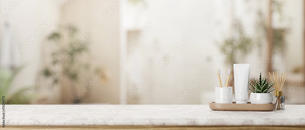 A presentation space on a white marble tabletop features toiletries in a luxurious bathroom. A presentation space on a white marble tabletop features toiletries in a luxurious bathroom.