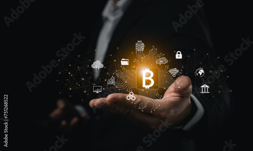 Businessman with Bitcoin and Technology Hologram. Businessman displaying a Bitcoin symbol within a network of technology and security icons. Cryptocurrency technology concept.
